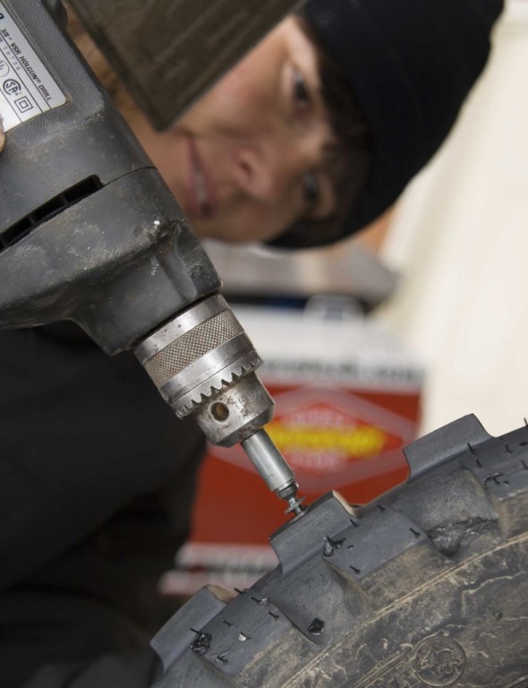 Women Who Ride: Doris Wiedemann drives studs into her tires for her winter ride across Alaska