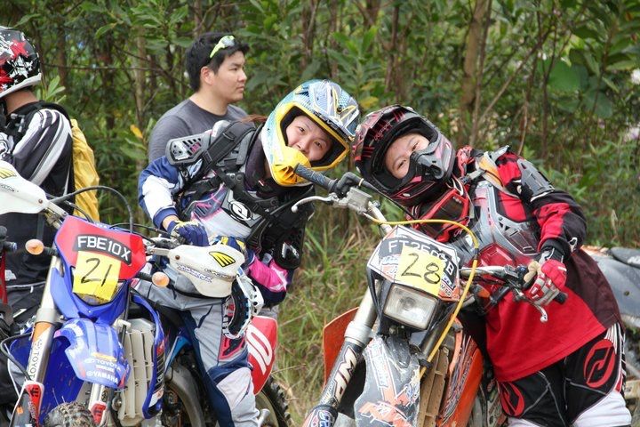 Women Who Ride: Juvena Huang at an enduro race start line with another lady racer