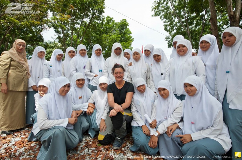 Women Who Ride: Lisa Thomas with a group of students in Sumatra