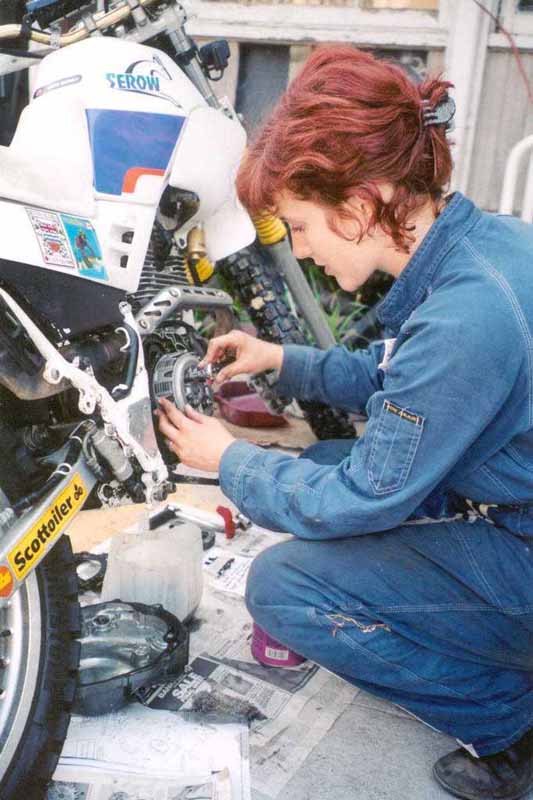 Women Who Ride: Lois Pryce changing the clutch on her Yamaha Serow