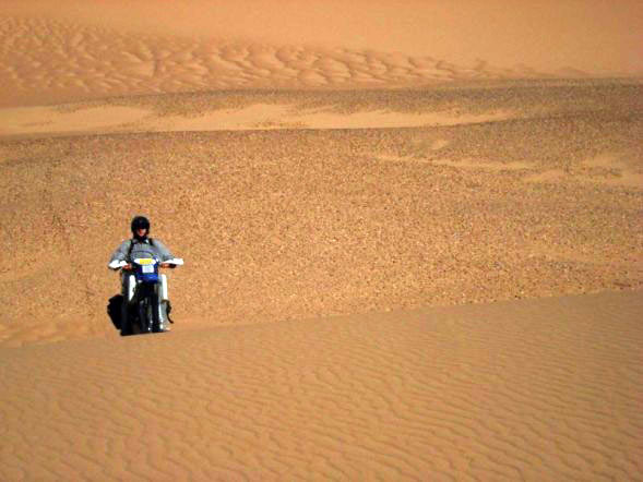 Women Who Ride: Lois Pryce crossing the sand dunes in Niger