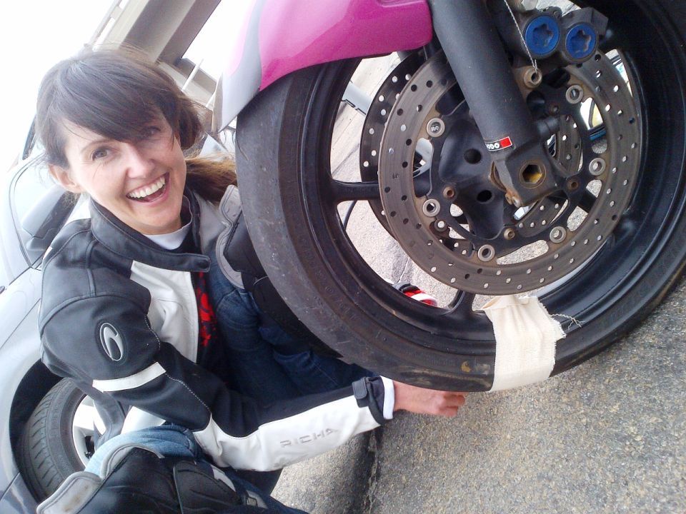 Women Who Ride: Skinny Van Schalwyck applying plasters to a cracked valve