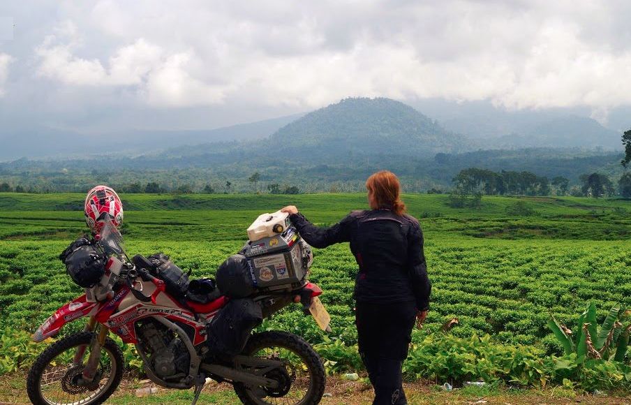 Women Who Ride: Steph Jeavons looking over tea fields in Malaysia