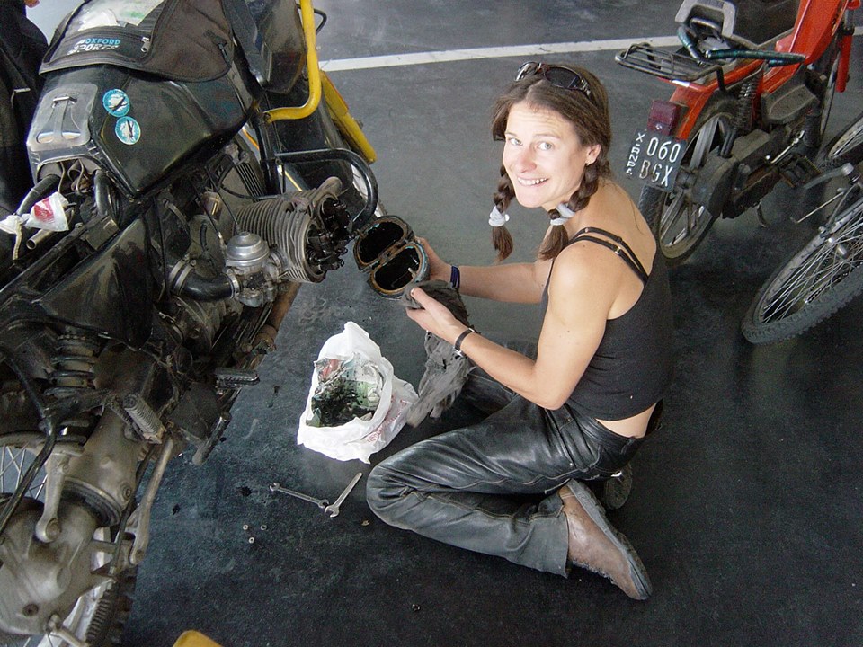 Women Who Ride: Tiffany Coates wrenching on her bike