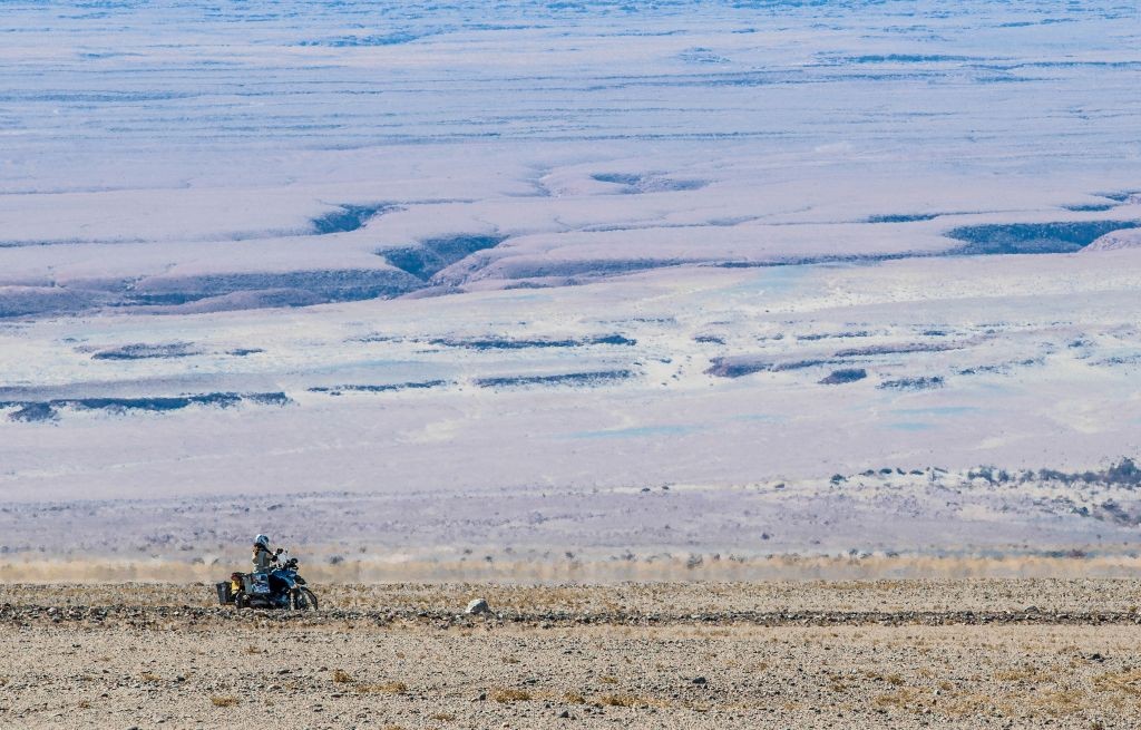 Riding through a heat haze and overlooking the plains in Chile