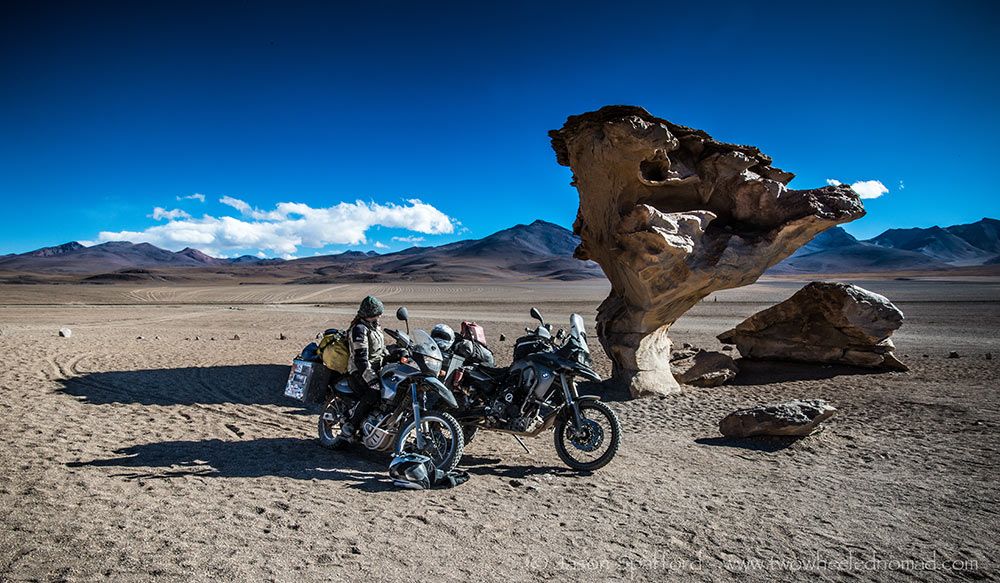 Two BMW motorcycles parked near the Árbol de Piedra (Stone Tree)